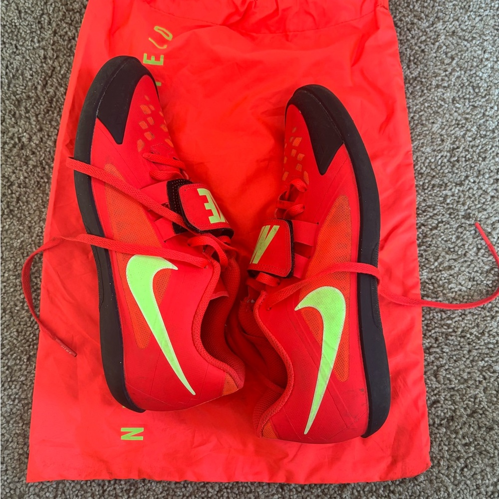 Nike Red and Black Athletic Shoes with Neon Green Swoosh